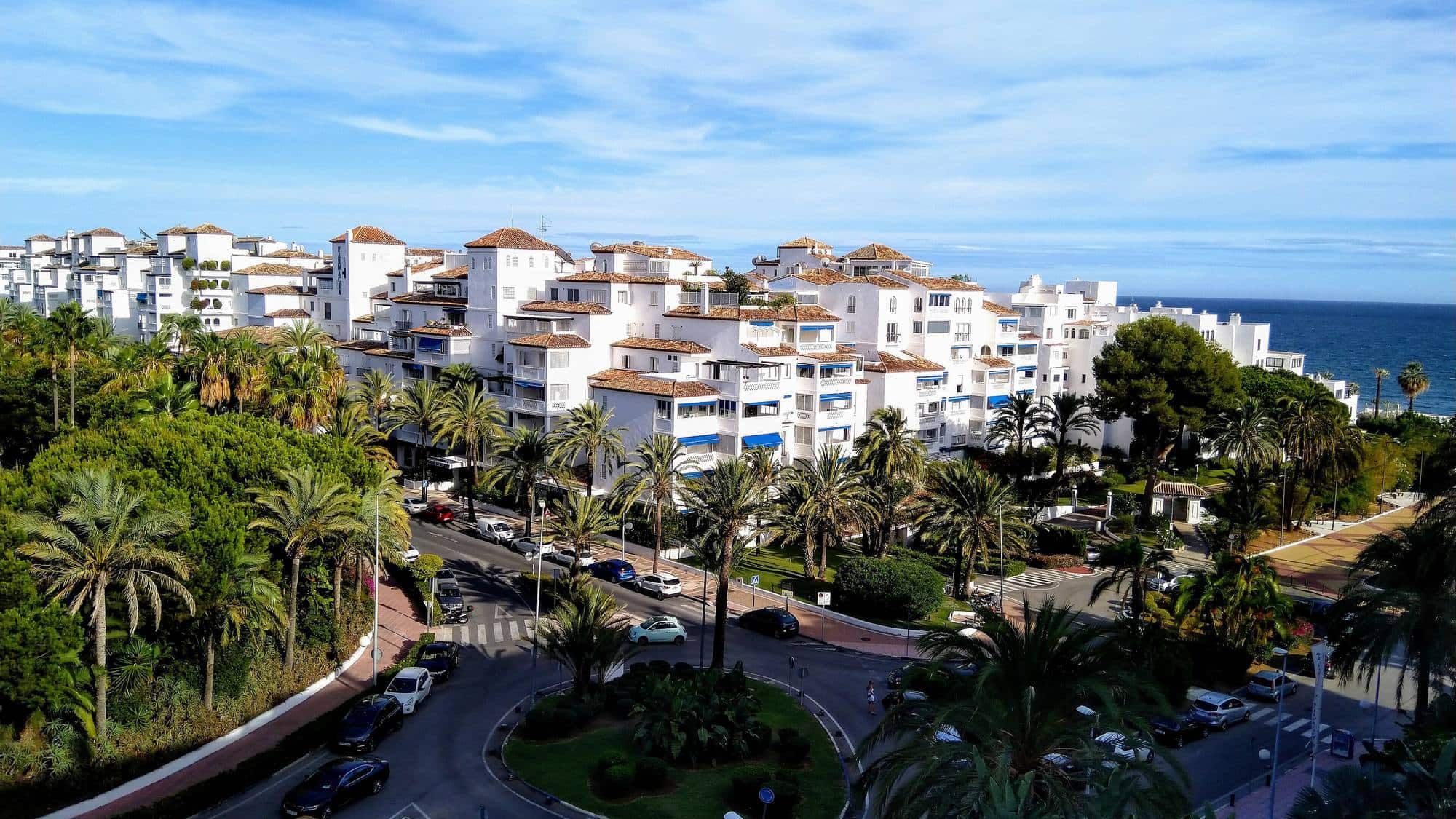 Apartments and palm-lined streets in Nueva Andalucía, Marbella